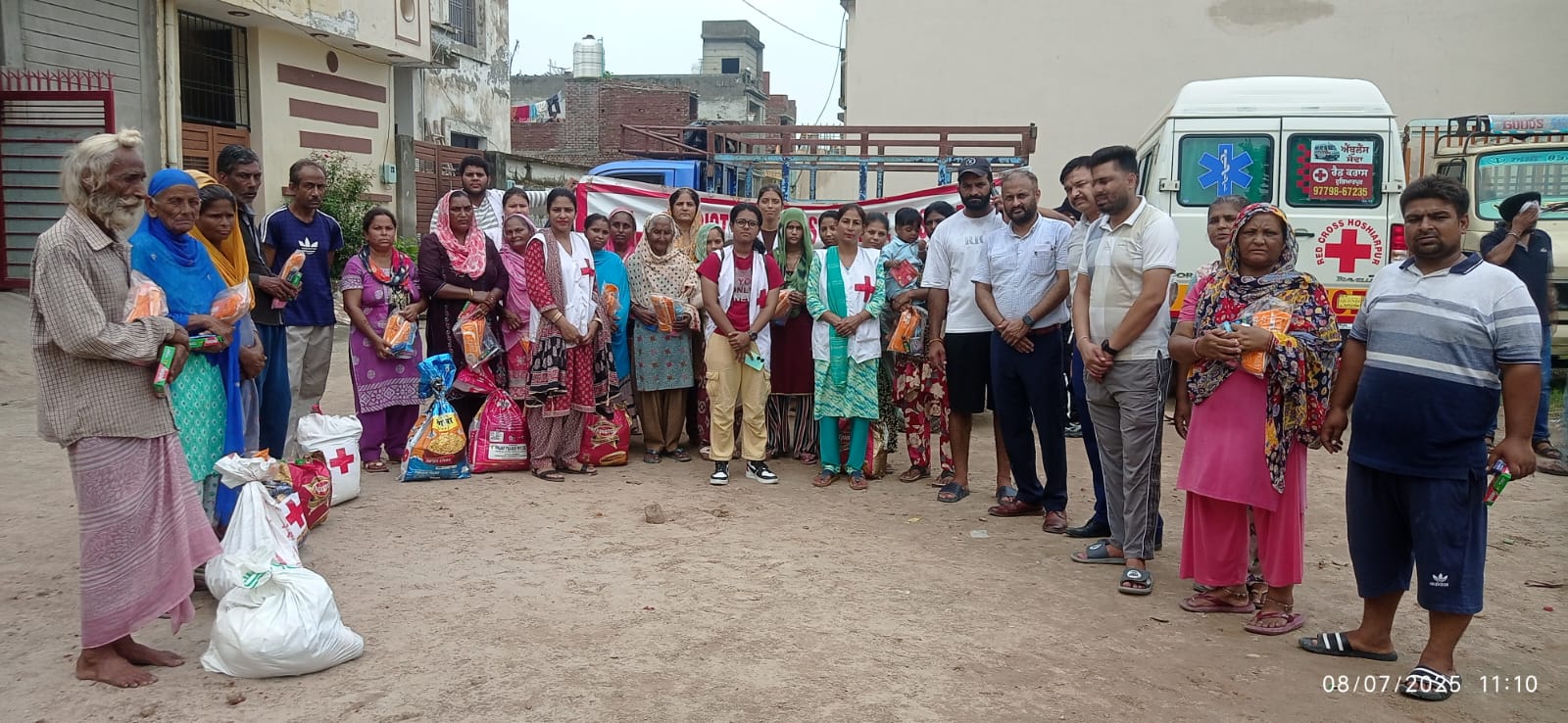 Red Cross distributed relief material to rain-affected families in Shanti Nagar.